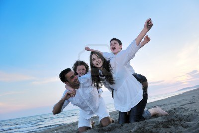 9900759-happy-young-family-have-fun-and-live-healthy-lifestyle-on-beach